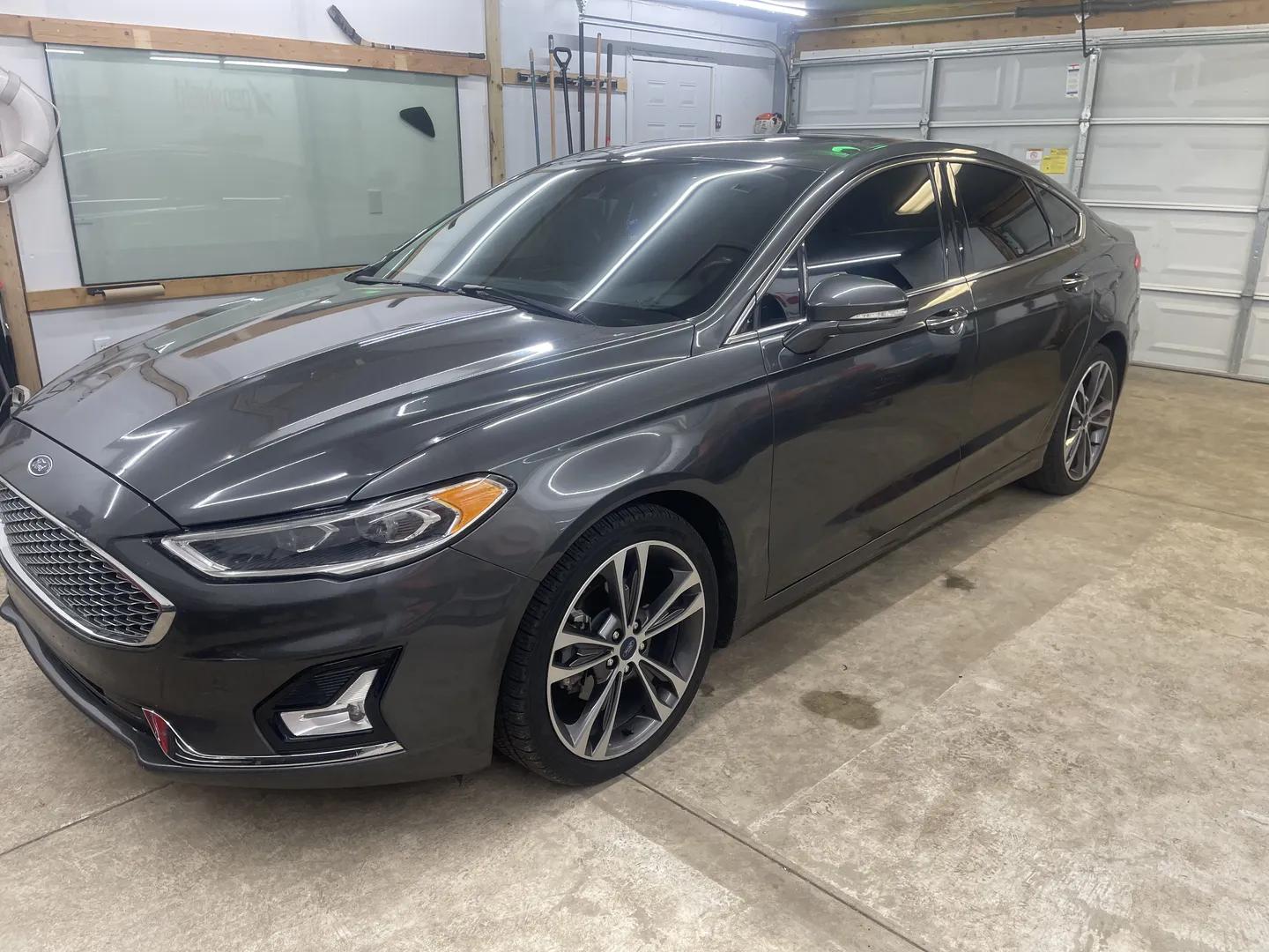 Installing Tints and ceramic coating at Great Lakes Auto Spa in Romulus, Michigan